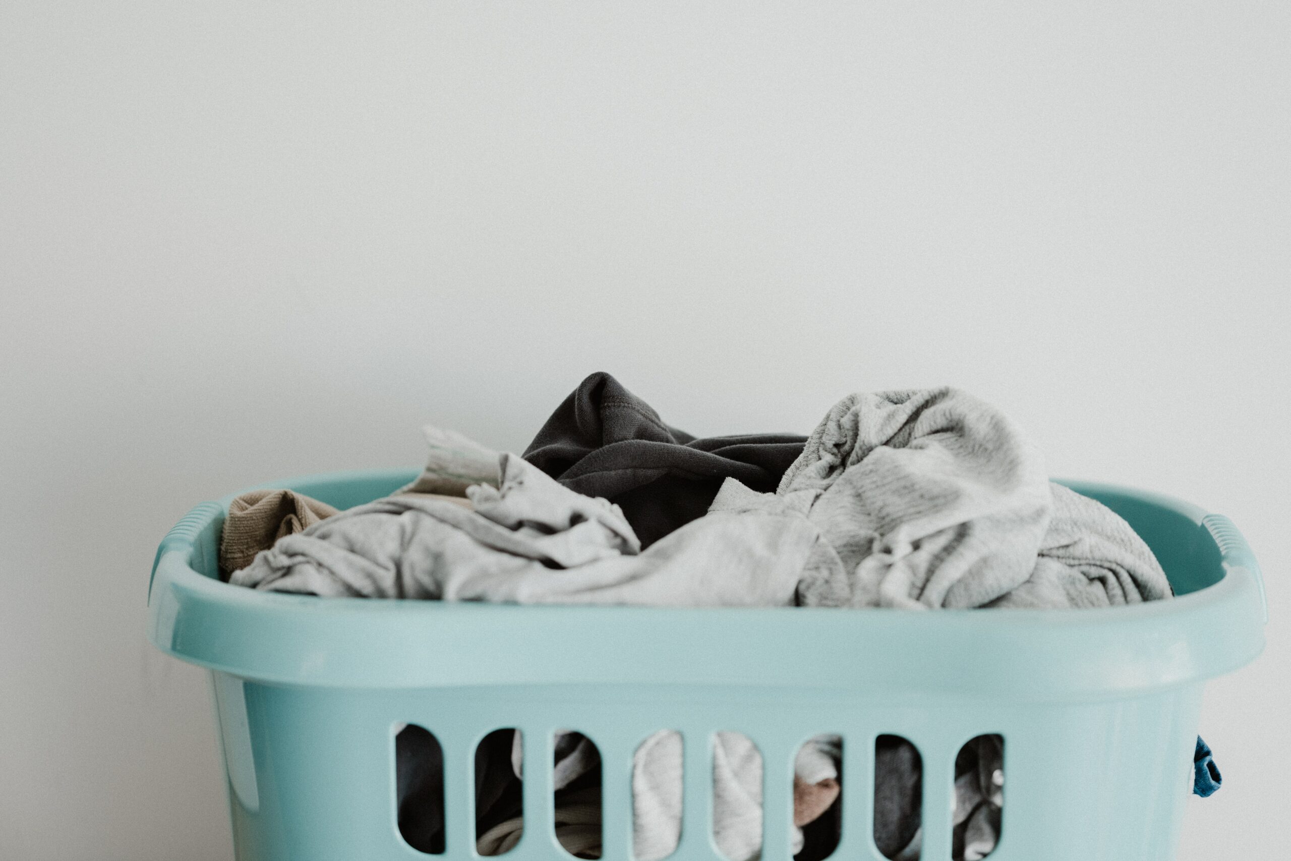 mixing jeans with towels in washing basket
