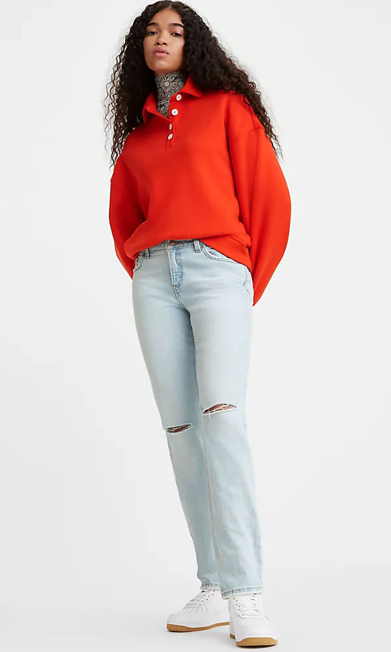 Woman wearing Levis low-pitch straight-fit jeans paired with a red top