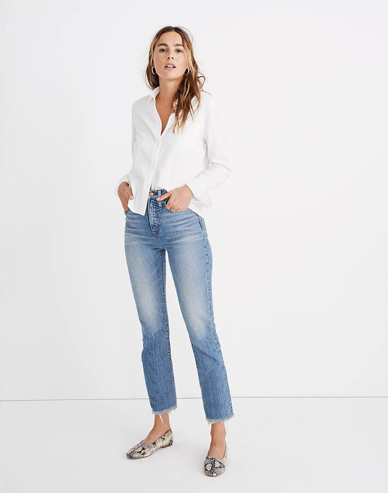 Woman wearing madewell perfect vintage jeans with white blouse