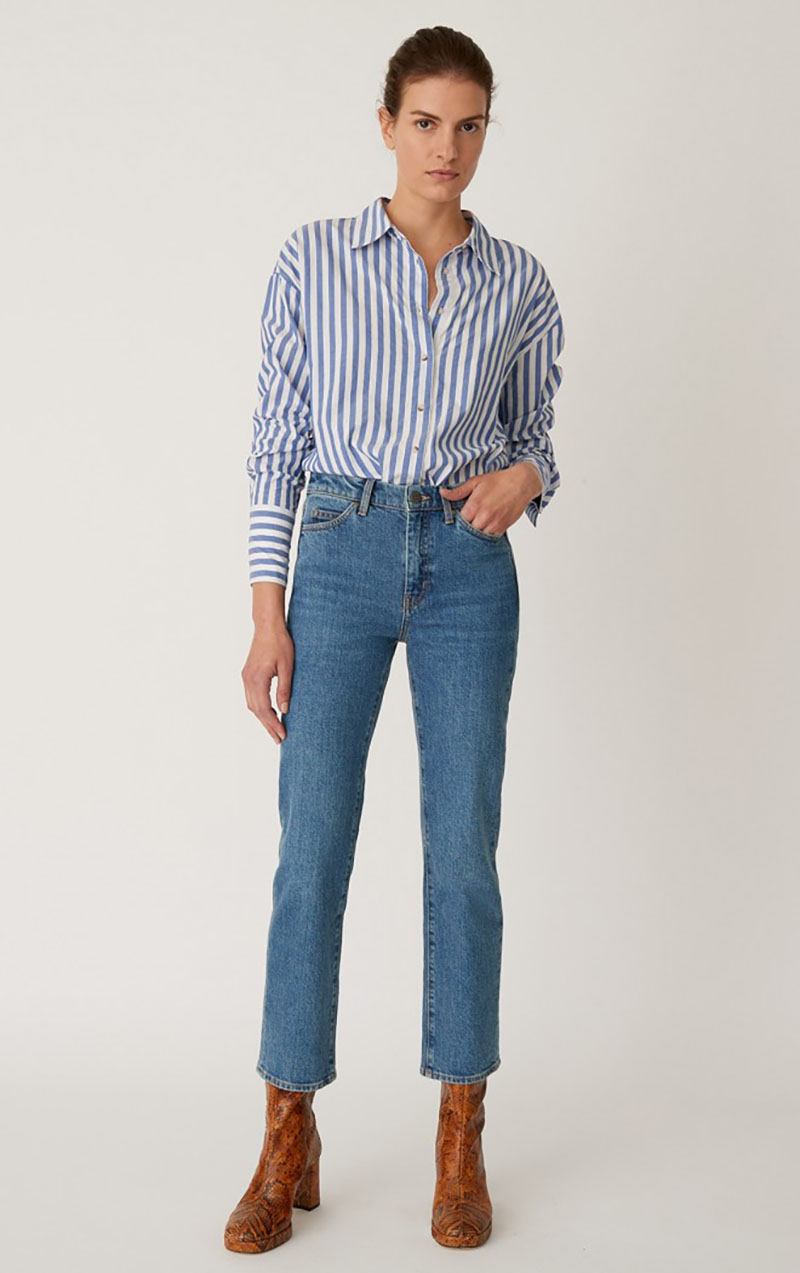 Model wearing M.i.h. daily jeans with brown ankle boots and a striped blouse